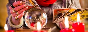 tarot reader holding cards